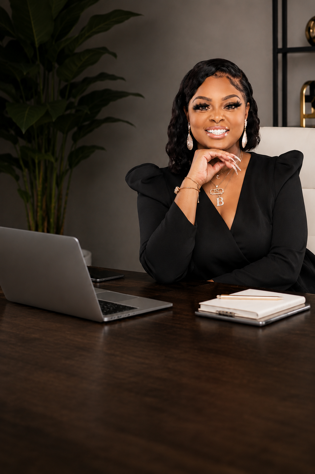 Credit repair specialist seated confidently at a desk with a laptop
